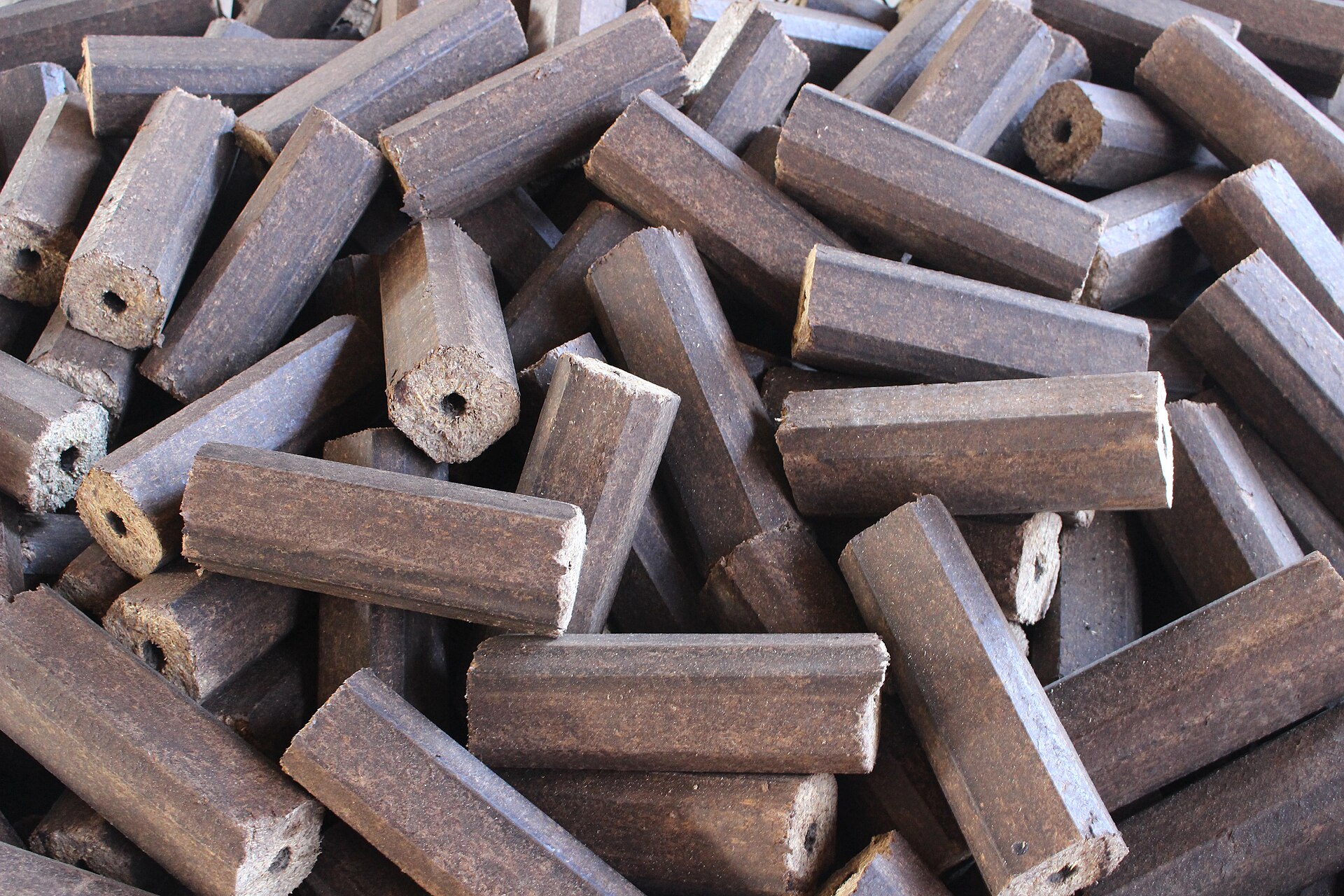 A pile of dense biomass briquettes